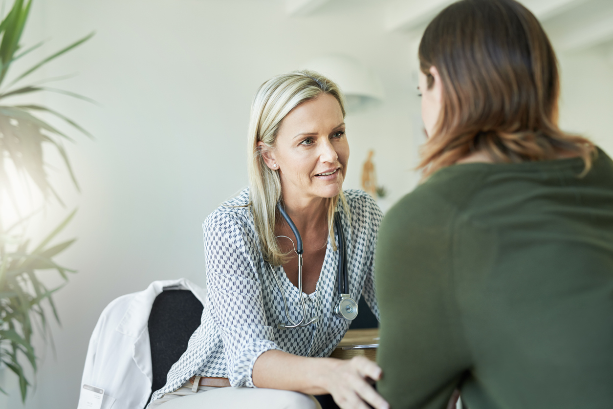 Woman specialist support patient with hand on shoulder